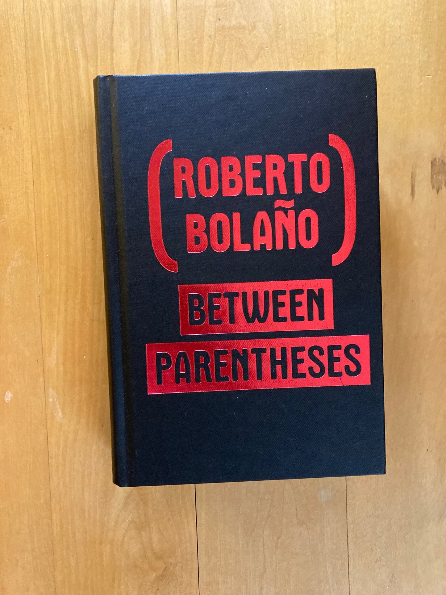 Between parentheses